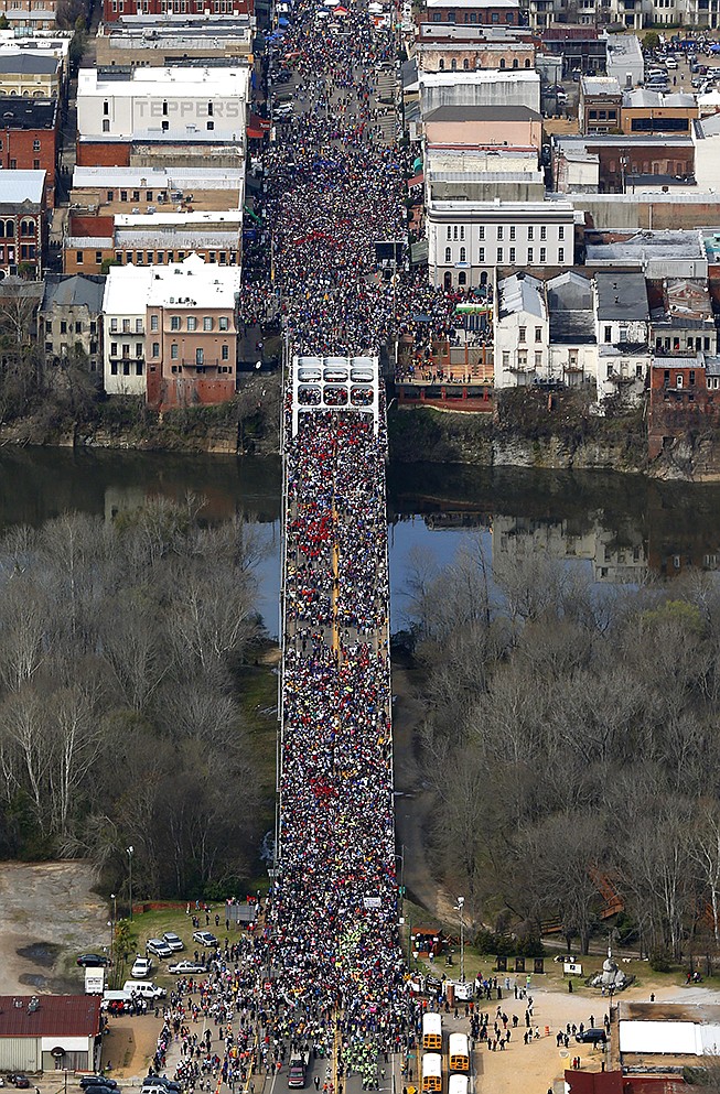 A massive throng of people move in a symbolic march across Edmund Pettus Bridge Sunday in Selma, Ala. This weekend marks the 50th anniversary of "Bloody Sunday" civil rights march.
