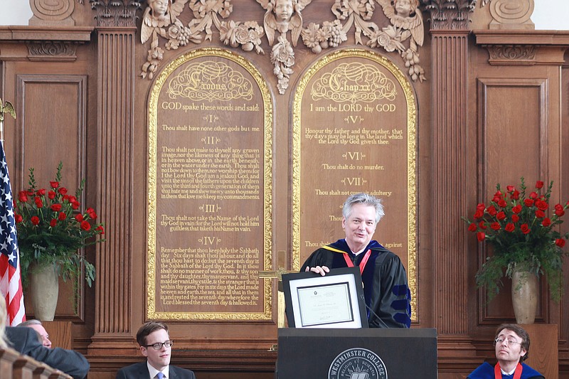 National Churchill Museum Executive Director Jim Williams accepts a certificate of establishment of the Sandra L. and Monroe E. Trout Professorship of Churchill Studies after the Kemper Lecture Sunday. Williams will hold the first professorship.