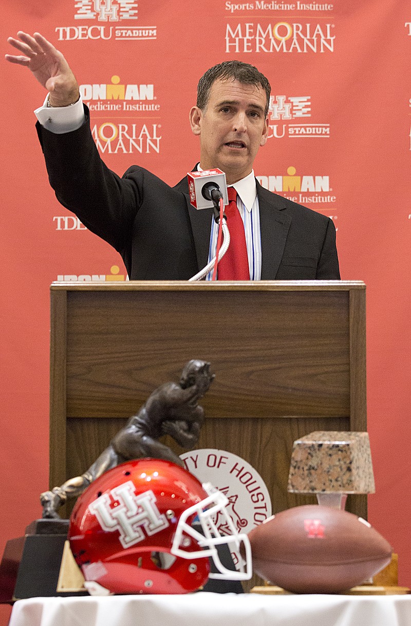 Mack Rhoades, shown speaking during a press conference in Houston while serving as Houston's athletic director in this Dec. 19, 2014, file photo, will be taking the same job at the University of Missouri.