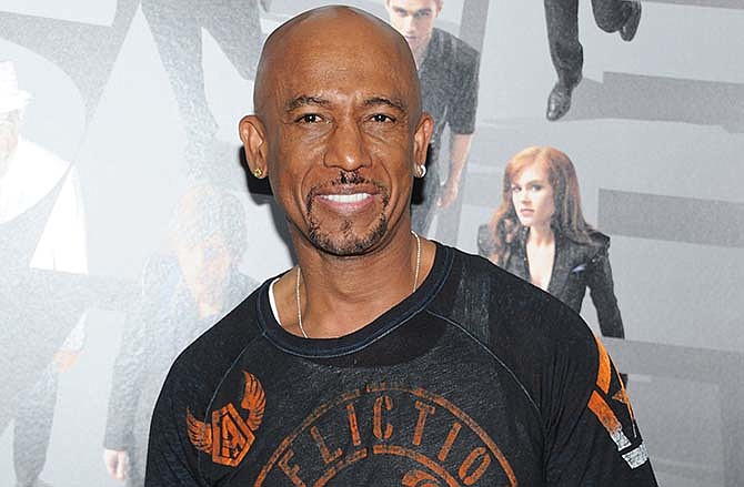 In this May 21, 2013 file photo, Montel Williams attends the "Now You See Me" premiere at AMC Lincoln Square, in New York. An online company is losing Williams as its celebrity pitchman in New York while agreeing to stop generating leads in the state for payday loans with interest rates sometimes topping 1,000 percent, regulators said Tuesday, March 10, 2015. Williams, a former Marine who hosted "The Montel Williams Show" for more than a decade, signed a consent order saying he'll stop endorsing MoneyMutual loans in New York, it said. 