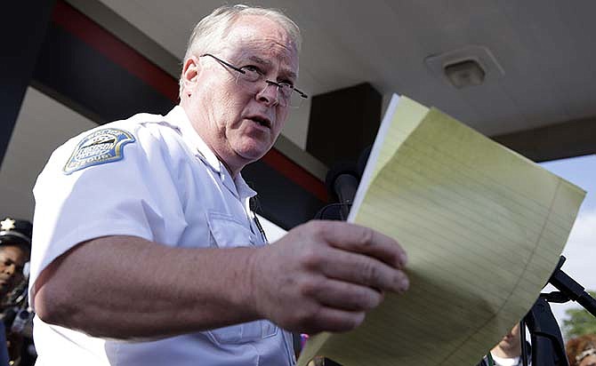  In this Aug. 15, 2014 file photo, Ferguson Police Chief Thomas Jackson talks at a news conference in Ferguson, Mo. Jackson has resigned in the wake of a scathing Justice Department report prompted by the fatal shooting of an unarmed black 18-year-old by a white police officer.