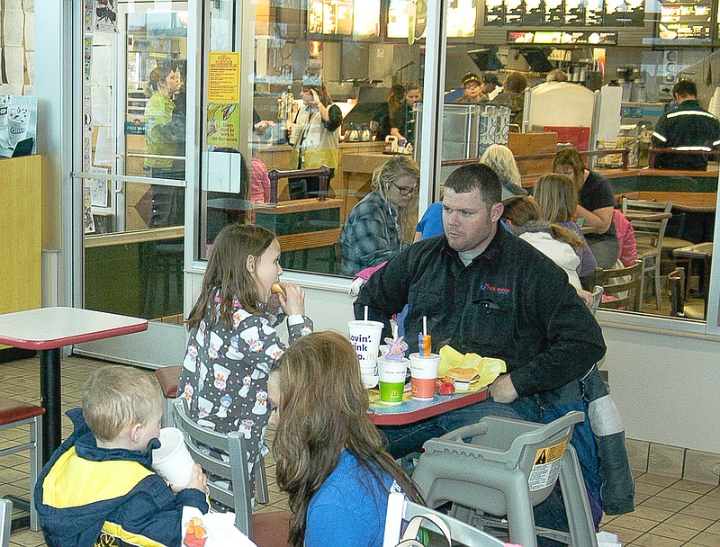 The playroom and dining area at McDonalds's is filled with children and family members on McTeacher's Night. California R-I teachers can be seen in the main part of the building.