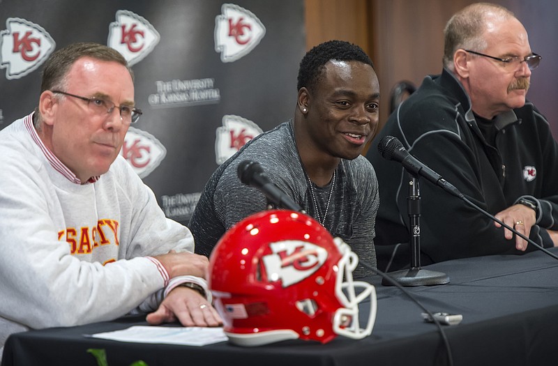 Jeremy Maclin (center), flanked by Chiefs general manager John Dorsey (left) and head coach Andy Reid, speaks during a press conference Wednesday at the Chiefs practice facility in Kansas City.