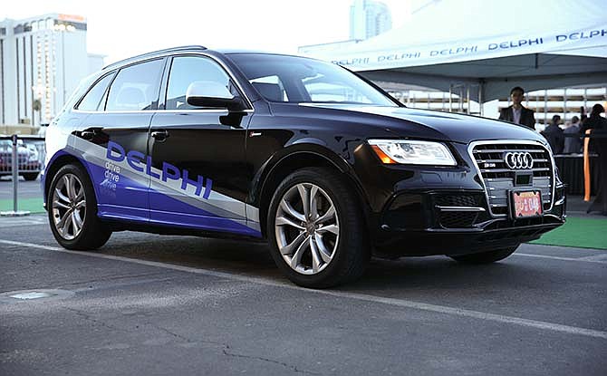 This undated photo provided by Delphi shows an Audi Q5 crossover outfitted with laser sensors, radar and multiple cameras. The autonomous car developed by Michigan-based auto supplier Delphi Automotive will soon be making a 3,500-mile journey across the U.S. A person will sit behind the wheel at all times but won't touch it unless there's a situation the car can't handle. The car will mainly stick to highways.