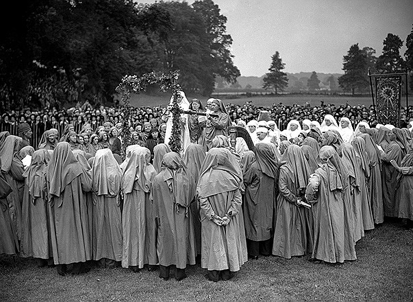In this 1939 file photo, participants in a "Gorsedd," a group of poets and bards, announce the upcoming 1940 Welsh Eisteddfod cultural festival at Bridgend, Glamorganshire, Wales. In report released Wednesday in the journal Nature, genetic samples collected from across the United Kingdom are shedding light on the ancient past, including Viking invasions and a mystery about the arrival of the Anglo-Saxons.
