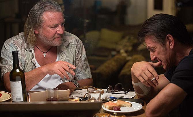 This image released by Open Road Films shows Ray Winstone, left, and Sean Penn in a scene from "The Gunman." 