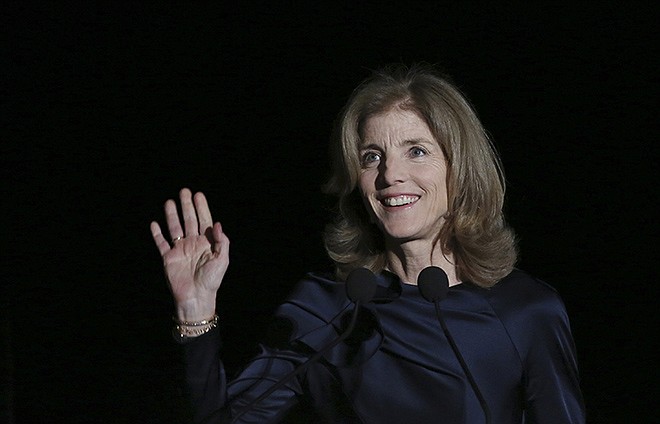 U.S. Ambassador to Japan Caroline Kennedy waves before she delivers opening remarks Wednesday during JFK International Symposium at Waseda University in Tokyo. Japanese police are investigating phone calls threatening to kill U.S. Ambassador Kennedy.