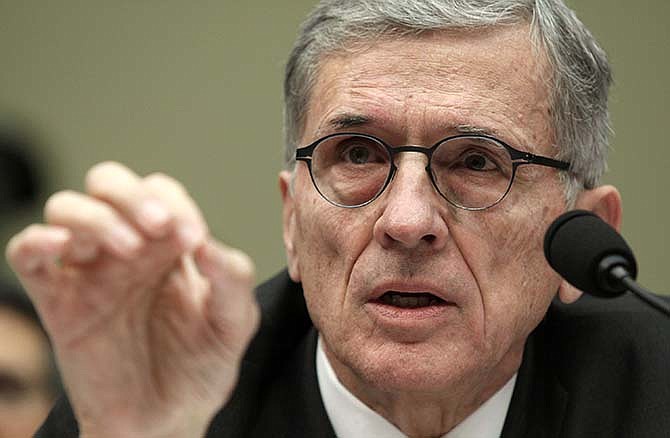 Federal Communications Commisison (FCC) Chairman Tom Wheeler testifies on Capitol Hill in Washington, Tuesday, March 17, 2015, before the House Oversight and Government Reform Committee hearing on net neutrality. A decision to impose tough new regulations on cable and wireless companies that provide Internet service to Americans wasn't influenced by politics, a top U.S. regulator told House lawmakers on Tuesday. 