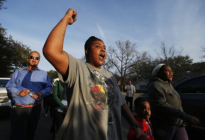 Charletteria Mathis, second from left, Albeta Wellington, far right, and her son Mark Wallace, 5, protest outside the family home of former University of Oklahoma Sigma Alpha Epsilon fraternity member Parker Rice in Dallas. 