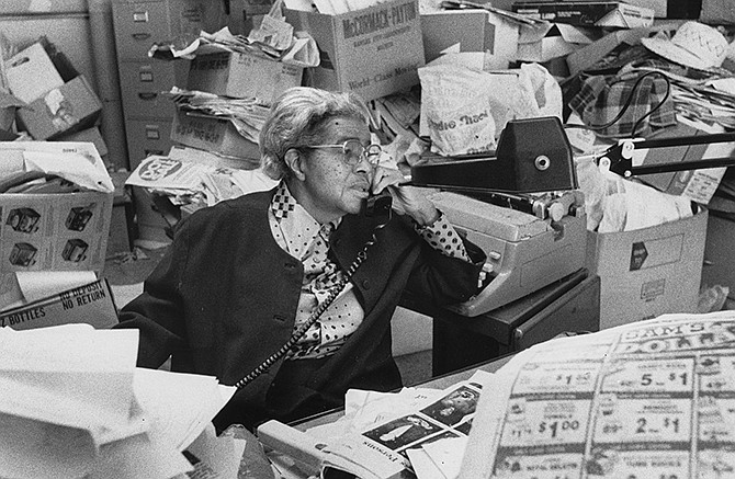 Lucile Bluford is shown working in the offices of the Kansas City Call. She eventually became the owner and publisher of the respected black weekly newspaper she joined in 1933. 