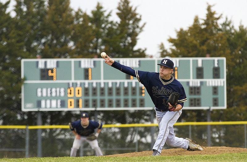 Helias pitcher Todd Buschjost throws a pitch in Tuesday's game with Fatima at the American Legion Post 5 Sports Complex. 