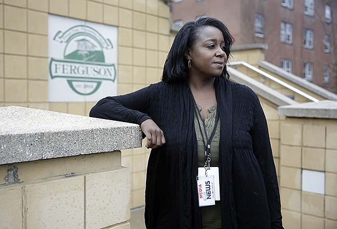 Freelance journalist Mary Moore poses for a portrait Tuesday before entering Ferguson Municipal Court. Moore was charged with municipal violations after an arrest on Oct. 3, while covering a demonstration outside Ferguson police headquarters.