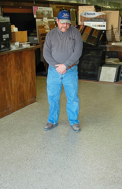 Democrat photo / David A. Wilson

Darryl Dutcher of K.A. Dutcher Paint and Carpet Company, California, checks out the newly completed epoxy flooring which has been installed in a heavy traffic area of the business.