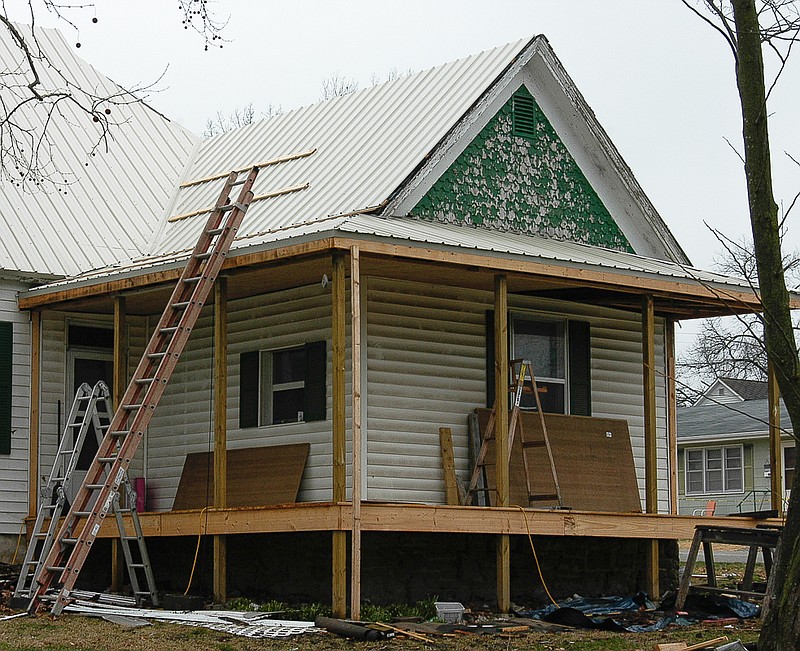 Democrat photo / David A. Wilson

The front porch of this older home on South Oak Street is being completely rebuilt and will add to both the looks and the life of the structure when completed.