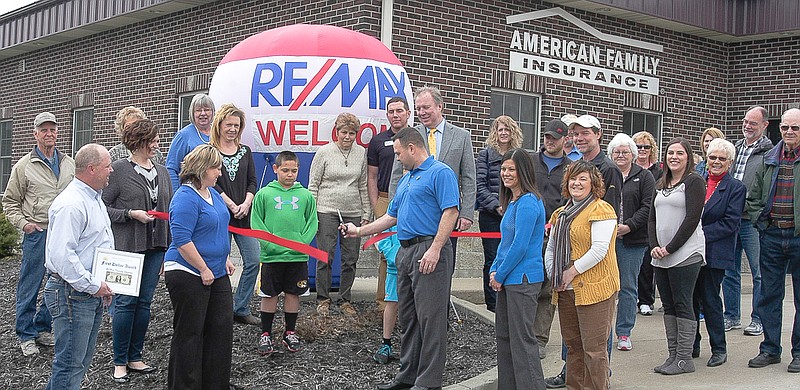 Democrat photo / David A. Wilson

Shane Dunnaway, Broker / Owner, cuts the ribbon for the event held by California Area Chamber of Commerce with many chamber members, family and friends present. The event was held Friday, March 20. Front row, from left, are Chamber President Jason Witt, owners Shawna Dunnaway, Shane Dunnaway (cutting the ribbon), Angie Rowles and Realtor Heather Borghart. Chamber member Amanda Trimble holds the left end of the ribbon and owner Ron Rowles holds the right end.