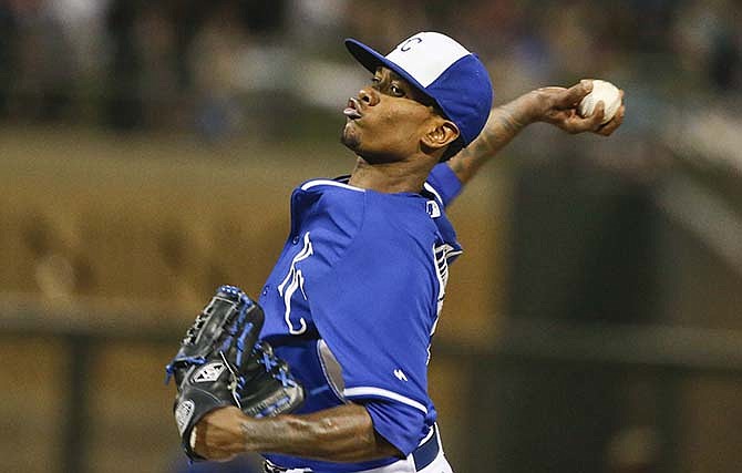 Kansas City Royals starting pitcher Yordano Ventura winds up against the Seattle Mariners in the fifth inning of a spring training baseball game Friday, March 27, 2015, in Surprise, Ariz.