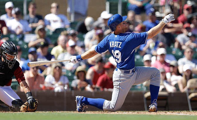 Kansas City Royals' Erik Kratz fouls off a pitch from Arizona Diamondbacks' Jeremy Hellickson in the fourth inning of a spring training exhibition baseball game Saturday, March 28, 2015, in Scottsdale, Ariz. 