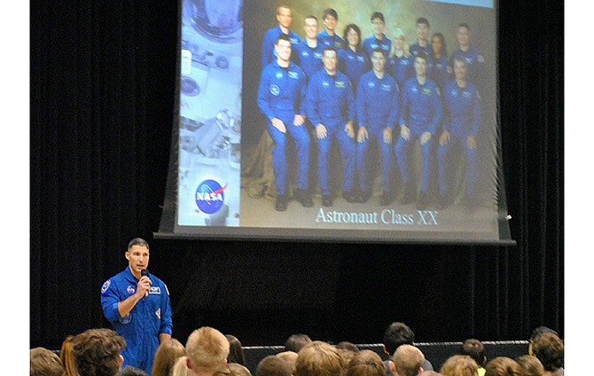 Col. Michael Hopkins, 1987 School of the Osage High School graduate and U.S. astronaut, shares his journey to serve as part of NASA's 20th class and a mission aboard the International Space Station during an Osage Science Day opening assembly Friday at the Osage Middle School in Kaiser, Mo.