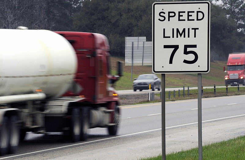 Trucks travel along I-45 near Huntsville, Texas. Many tractor-trailers on the nation's roads are driven faster than the 75 mph their tires are designed to handle, a practice that has been linked to wrecks and blowouts but has largely escaped the attention of highway officials. 