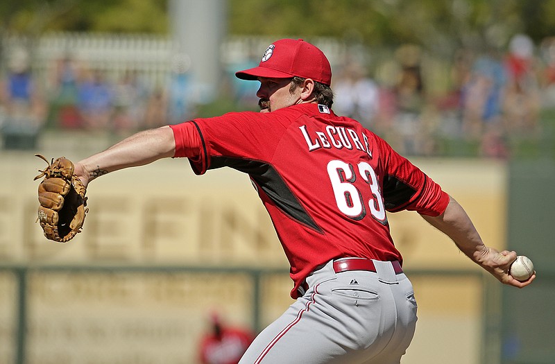 Reds relief pitcher Sam LeCure works to the plate during a spring-training game against the Royals on March 7 in Surprise, Ariz. The graduate of Helias High School was sent to the minors Thursday in the final round of roster moves by the team.