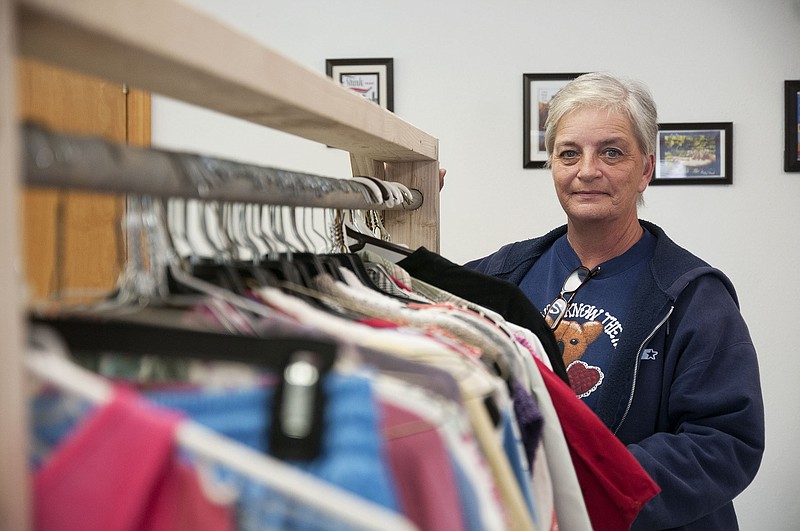 Connie Cashion, better known as Ms. Connie, of Holts Summit, poses for photo inside her free store titled, From HIS HOUSE To Your House, on Friday. Cashion will provide clothing and household items to those in need at the free store, located at 301 Pioneer in Fulton. The store has been a longtime dream for Cashion.