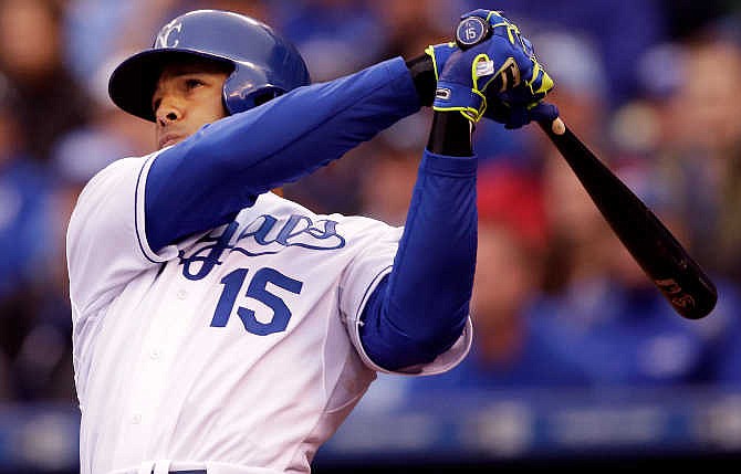 Kansas City Royals right fielder Alex Rios (15) hits a three-run home run during the seventh inning of a baseball game against the Chicago White Sox at Kauffman Stadium in Kansas City, Mo., Monday, April 6, 2015.