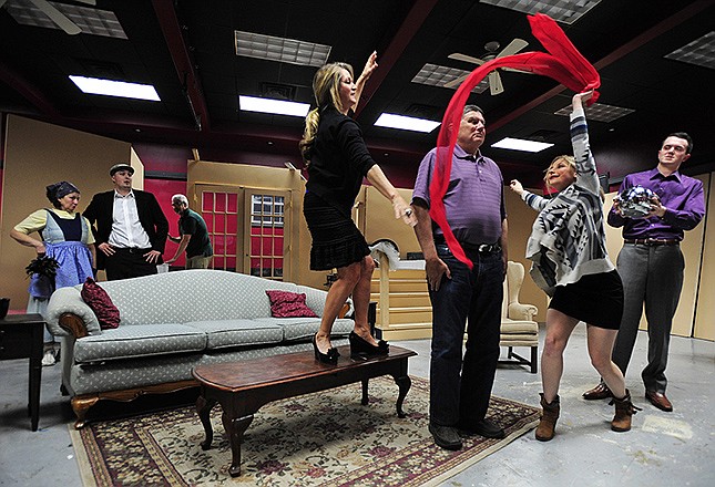 Cast members run through a scene while rehearsing for The Little Theatre of Jefferson City's upcoming production of the murder mystery "Death by Design."