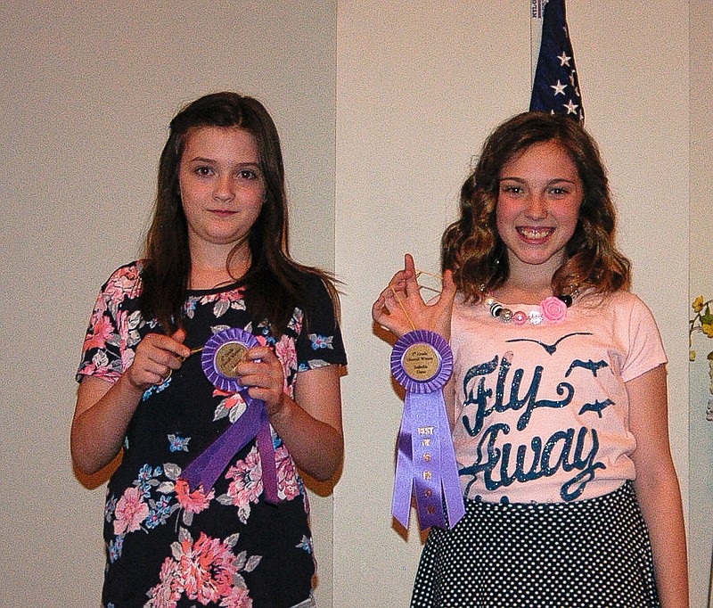Democrat photo / David A. Wilson

The top winners of the 2015 Soil and Water Conservation District poster contest are, from left, sixth grader Lauren Dietzel and fifth grader Isabella Gano. The poster theme was "Local Heroes: Your Hardworking Pollinators."