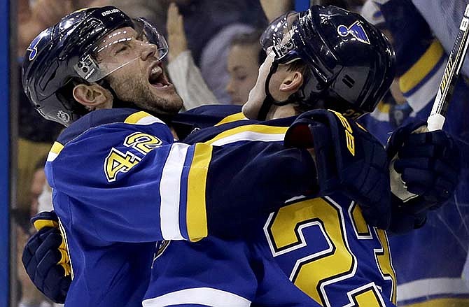 St. Louis Blues' Dmitrij Jaskin, of Russia, is congratulated by teammate David Backes, left, after scoring during the second period of an NHL hockey game against the Chicago Blackhawks on Thursday, April 9, 2015, in St. Louis.