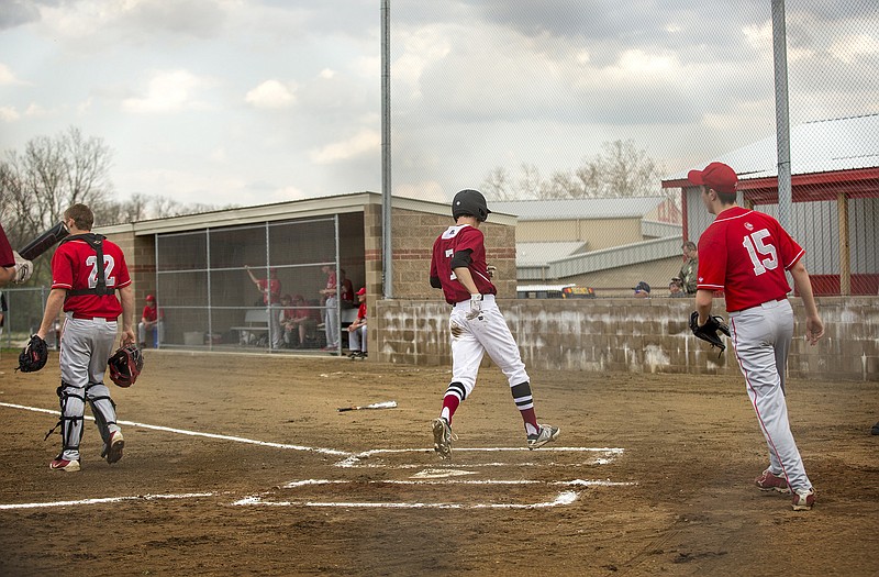 Linn's Cameron Laughlin crosses home plate during the first inning of Thursday's game against Calvary Lutheran at Calvary Lutheran Field.