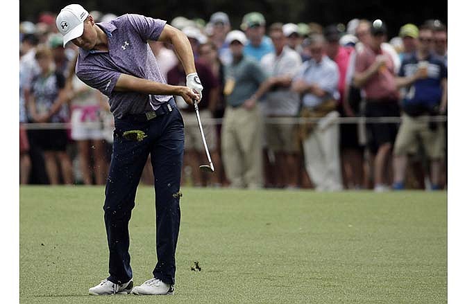 Jordan Spieth hits on the 15th fairway during the second round of the Masters golf tournament Friday, April 10, 2015, in Augusta, Ga.