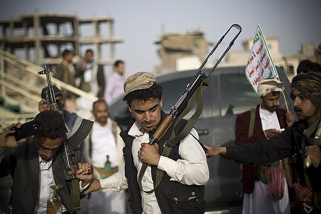 Shiite rebels, known as Houthis, perform a traditional dance Friday during a protest against Saudi-led airstrikes in Sanaa, Yemen.