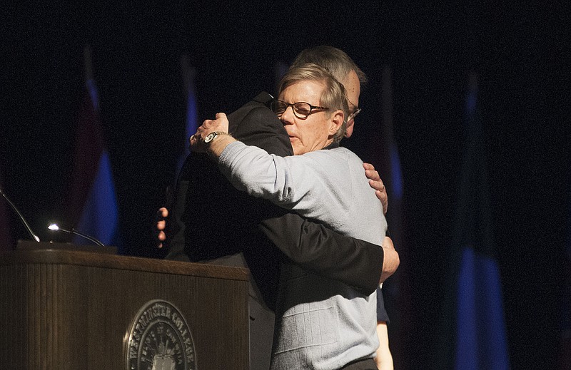 Westminster College outgoing president Barney Forsythe hugs Bob Seelinger, classics professor, after Seelinger's speech on Forsythe's tenure at the college. Forsythe will retire at the end of the academic year after 10 years working at Westminster and acting as its president since 2008.