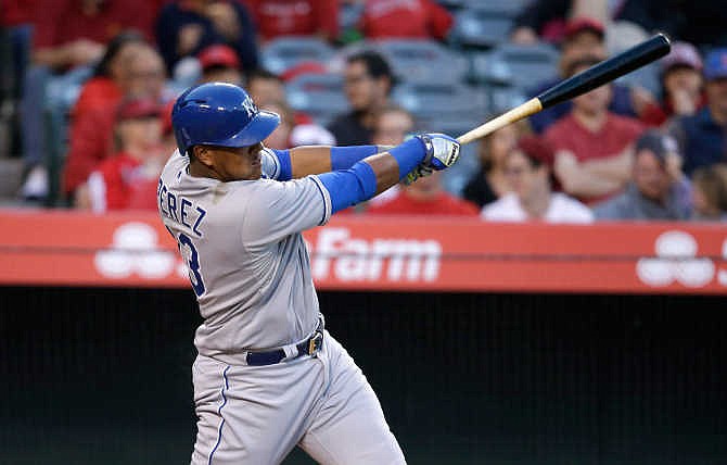 Kansas City Royals' Salvador Perez hits a two-run home run during the fourth inning of a baseball game against the Los Angeles Angels, Saturday, April 11, 2015, in Anaheim, Calif. 