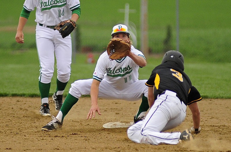 Blair Oaks second baseman Dylan Hoelscher waits for the throw as Fulton's Luke Gray tries to advance to second after a throwing error to first during Monday's game at the Falcon Athletic Complex in Wardsville. Gray was tagged out on the play.