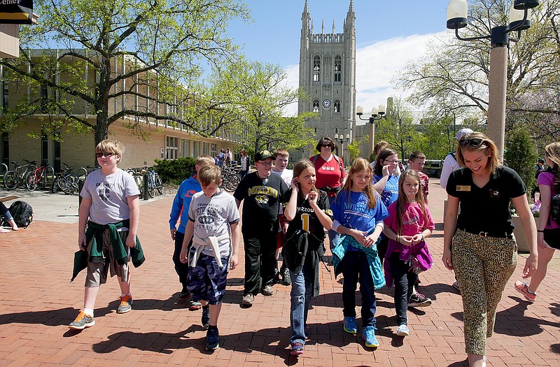 Area fifth graders make their way across Francis Quadrangle Tuesday on the University of Missouri campus in Columbia. 
