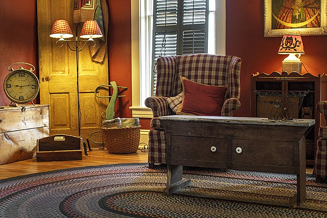 Laura Ward has incorporated various antique items, along with modern pieces, into the living room decor of her Jefferson City home.