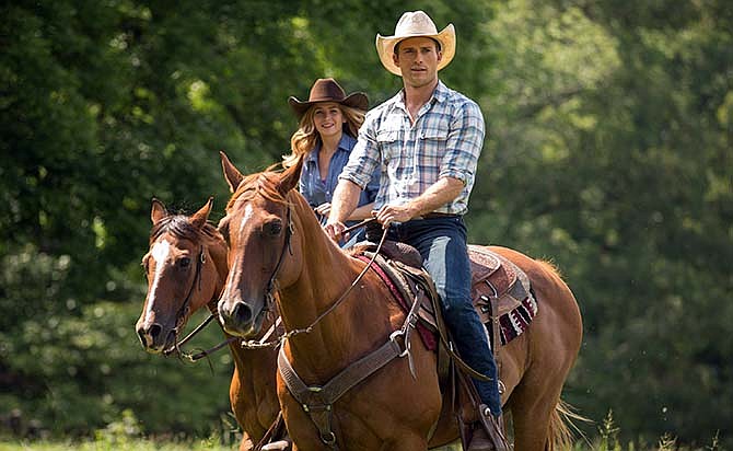 This photo provided by Twentieth Century Fox shows ,Scott Eastwood as Luke, and Britt Robertson, as Sophia, in a scene from the film, "The Longest Ride," directed by George Tillman, Jr. The movie releases in the U.S. on April 10, 2015.