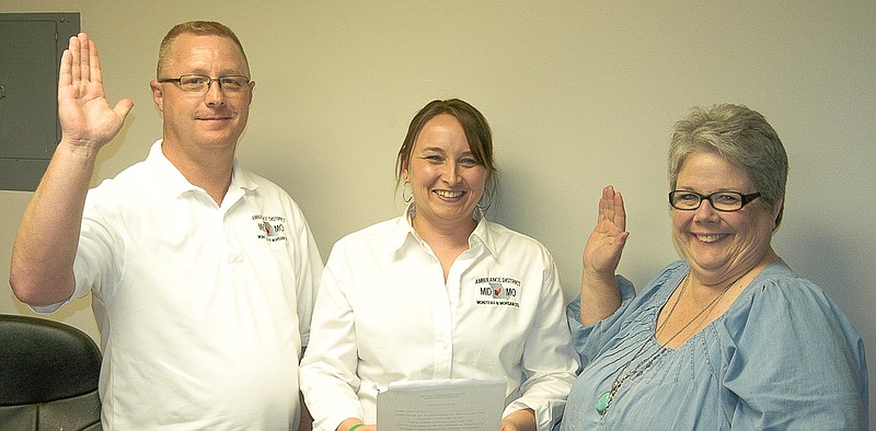 Democrat photo / David A. Wilson

Cody Worthley, left, and Becky Holloway, right, are sworn in by Notary Tasha Knapheide, center, as returning members of the Mid-Mo Ambulance Board of Directors. Each will serve a three-year term.