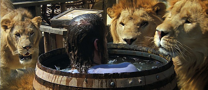 This photo provided by Drafthouse Films and Olive Films shows a scene from the film, "Roar," with actor John Marshall surrounded by lions. The movie is releasing in U.S. theaters for the first time today.