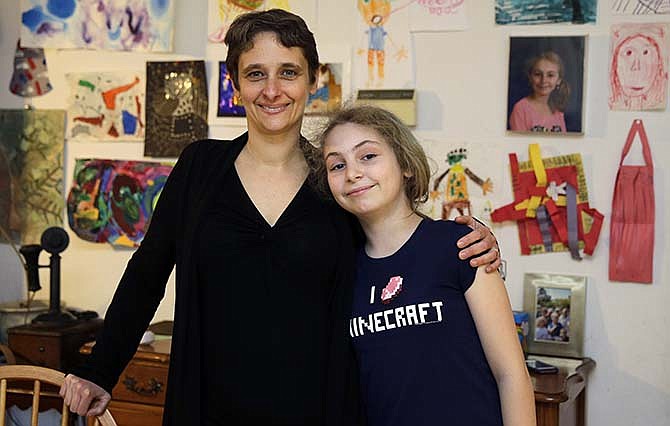 In this Thursday, April 16, 2015 photo, Meredith Barber poses with her daughter Gabrielle Schwager, 10, at their home in Penn Valley, Pa. Barber, a psychologist from the Philadelphia suburb of Penn Valley, has decided Gabrielle will not be taking the Pennsylvania System of School Assessment this year and has been encouraging other parents to opt out. 