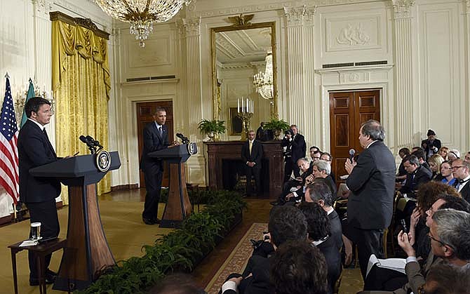 President Barack Obama and Italian Prime Minister Matteo Renzi listen to a reporter's question during their joint news conference in the East Room of the White House in Washington, Friday, April 17, 2015. The leaders discussed Europe's economy, a pending trade pact between the U.S. and Europe, climate change and energy security.