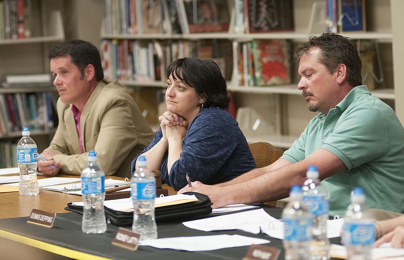 Fulton Public Schools Board of Education members (from left) Todd Gray, Kristi Donohue and Dennis Depping listen to parent concerns during Wednesday's board meeting. 