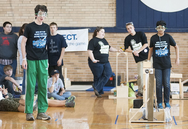 Ladue Middle School students Max Kornfeld, 14, and Raj Paul, 13, watch as a ping pong ball launches inside the Westminster College Gymnasium on Saturday during the Missouri Science Olympiad.