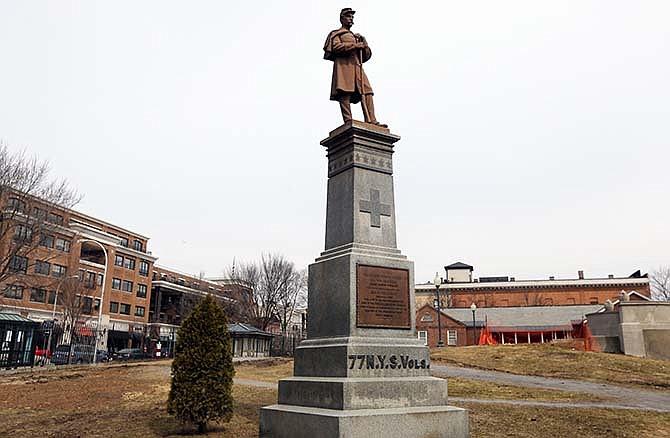 In this Monday, April 6, 2015 photo, a Civil War statue is on display at Congress Park in Saratoga Springs, N.Y. In the decades after the Civil War ended in April 1865, statues depicting Union and Confederate soldiers were placed in countless American communities, from New England commons to the grounds outside Southern courthouses. A century and a half later, these weathered "Silent Sentinels" still stand guard, most of them at "parade rest" with their muskets at the ready, gazing off in the distance. 