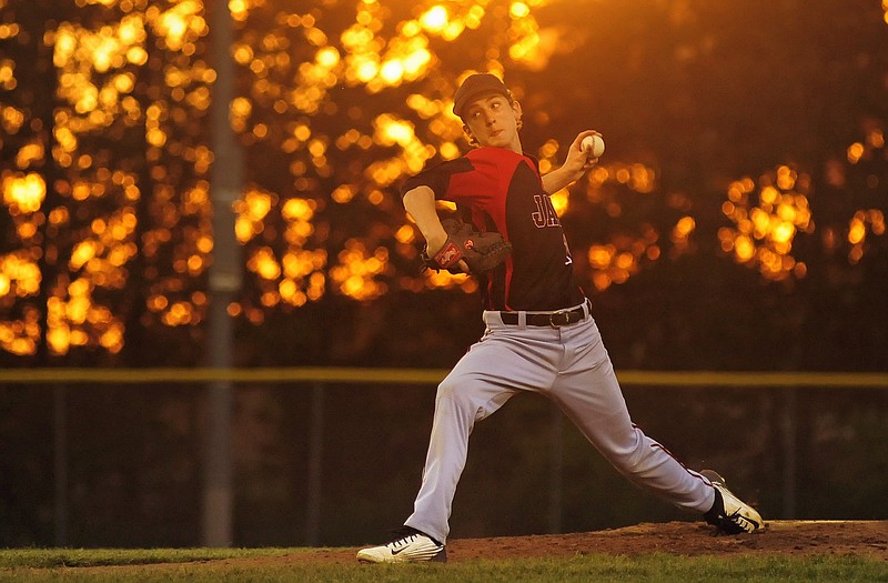 Jefferson City sophomore starting pitcher Jacob Weirich winds up and fires a pitch from the mound during Friday's game against Helias. Weirich threw a perfect game.