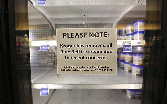 A sign explains why shelves sit empty of Blue Bell ice cream at a grocery store in Dallas, Tuesday, April 21, 2015. Texas-based Blue Bell Creameries issued a voluntary recall Monday, April 20, 2015, for all of its products on the market after two samples of chocolate chip cookie dough ice cream tested positive for Listeriosis. 