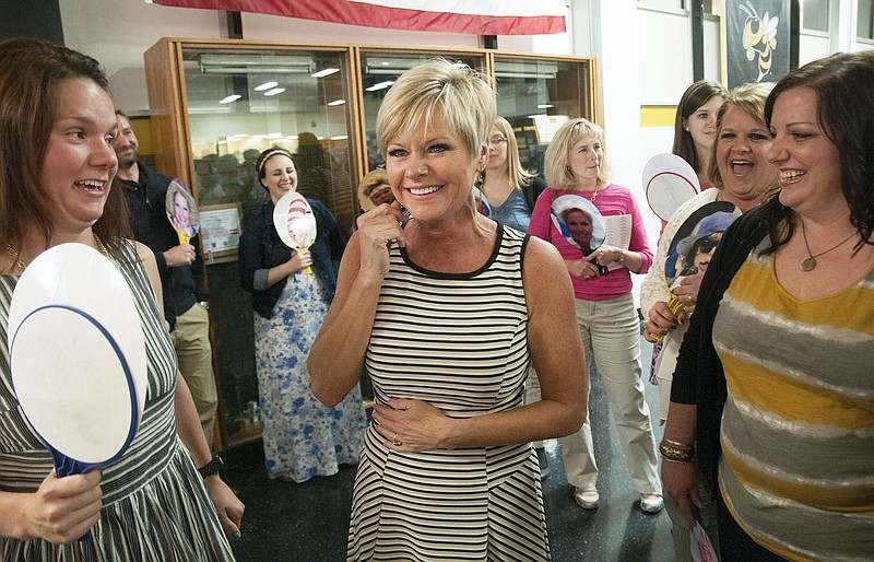 Robyn Frame, kindergarten teacher at Bartley Elementary School, laughs with her co-workers at the conclusion of the Fulton Public Schools End of the Year Gathering. She was honored Wednesday night with the Teacher of the Year award.