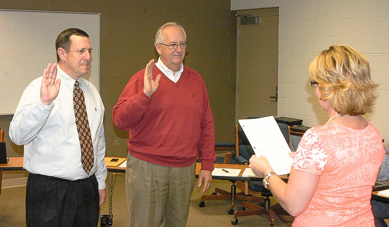 

California R-I School Board members, from left, Jay VanDieren and Paul Bloch are sworn in for additional three-year terms by Board Secretary Susie Oliver. The ceremony was performed at the regular school board meeting Wednesday, April 15.