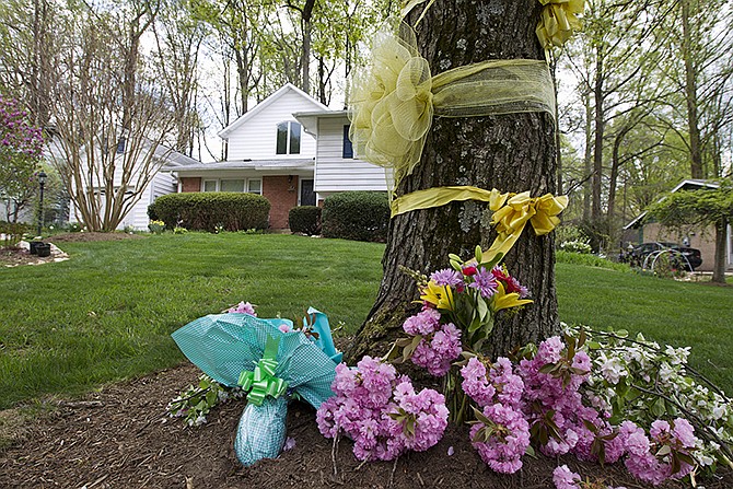 Flowers and ribbons adorn a tree outside the Weinstein family house in Rockville, Maryland, Thursday. President Barack Obama took full responsibility for the counterterror missions and offered his "grief and condolences" to the families of the hostages, Warren Weinstein and Giovanni Lo Porto who were inadvertently killed by CIA drone strikes early this year.  